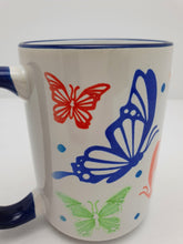 Load image into Gallery viewer, Tea Coffee Mug Ideal Gift Hand Printed Butterfly Design 15oz Blue Handle and Rim Butterfly Mug Harbourside Gifts
